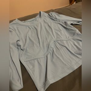 Light blue long sleeve. Says medium size 6 but fits xs/small. Never worn